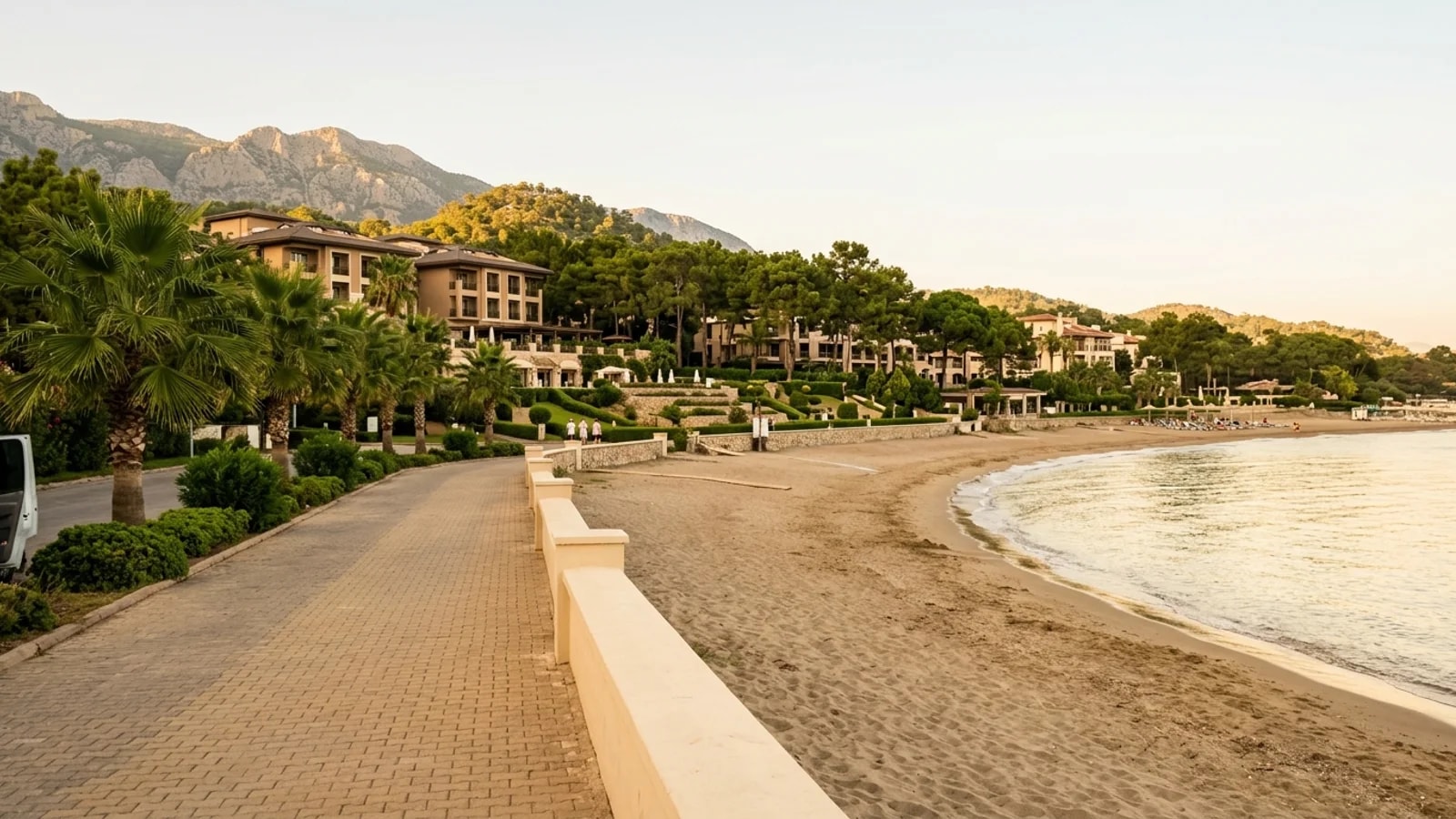 Holiday resort beach in Çenger Sandy beach at Çenger with resort hotels, pine trees, and the Taurus foothills approaching the coast.