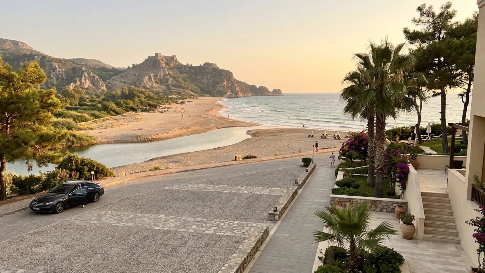 Alara river mouth and historic castle ruins. The Alara stream meets the sea by a sandy beach, with a distant castle ruin on hills.
