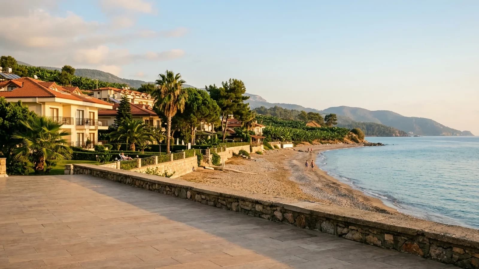 Quiet beach and coast in Yeşilöz A quiet beach at Yeşilöz below the coast road, with banana plantations and wooded hills behind.